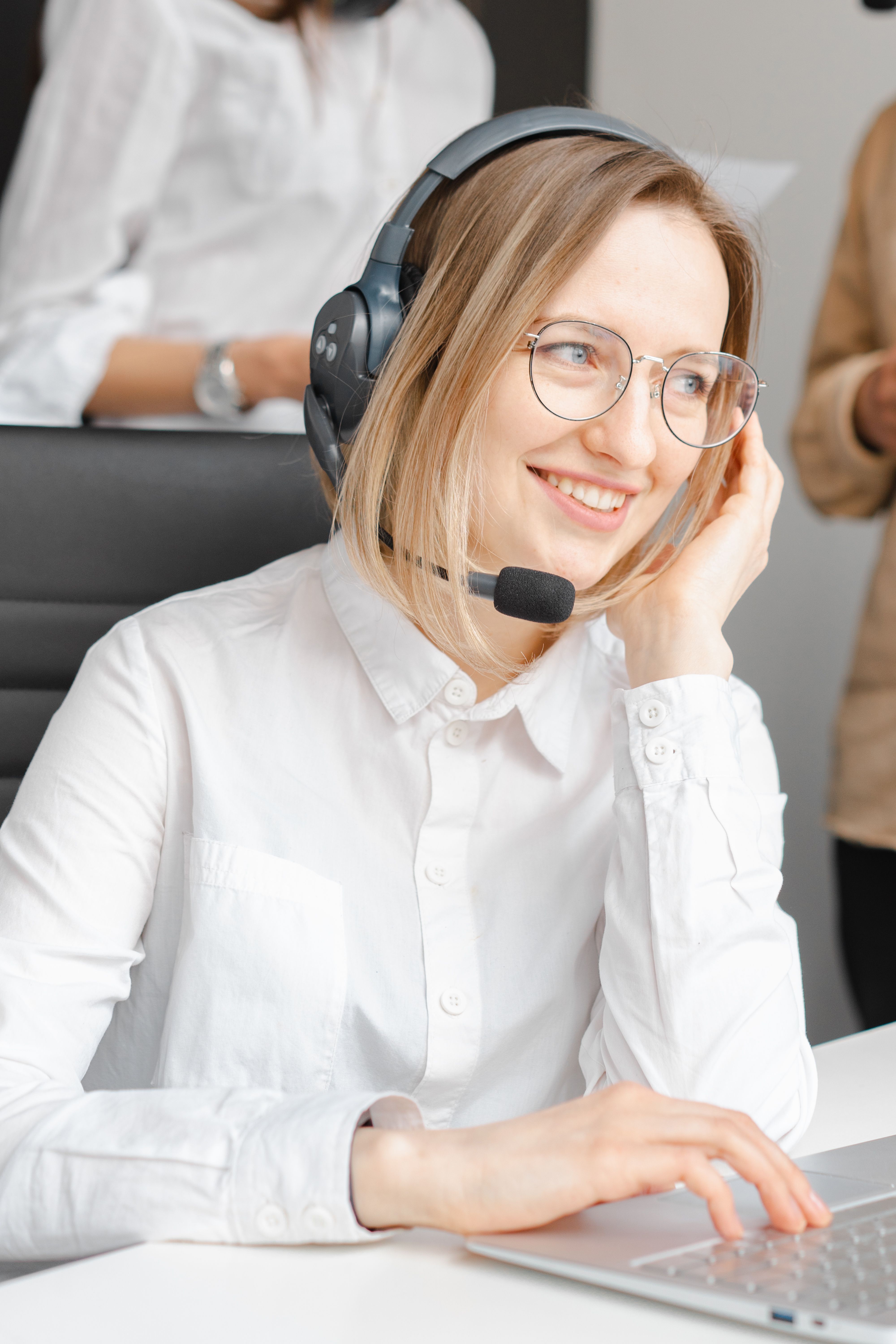 Interconnect Services call center agent on a headset in the call center